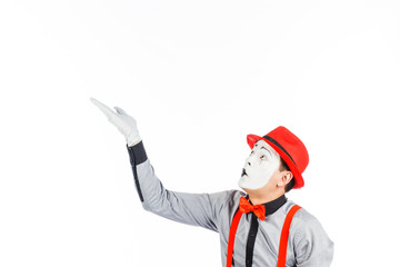 Portrait of a man, an artist, a pantomime. Shows something, isolated on white background