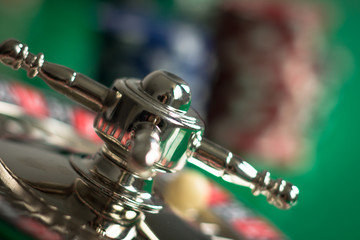 Casino theme. casino roulette, poker game, dice game, poker chips on a gaming table,  Place for typography and logo.