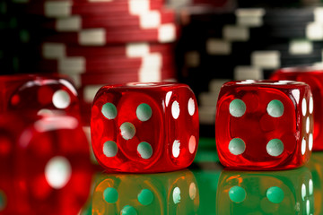 Casino theme. casino roulette, poker game, dice game, poker chips on a gaming table,  Place for typography and logo.