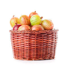 gooseberries in a wooden bowl. Gooseberries fresh berries. red green gooseberry on white