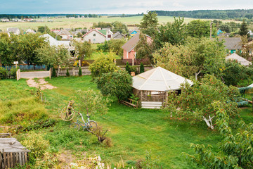 Obraz premium Belarusian Or Russian Wooden Guest House In Village Or Countrysi