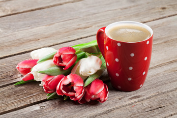 Colorful tulips bouquet and coffee cup