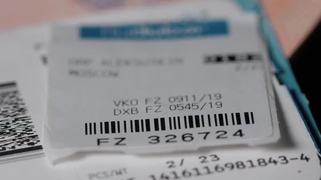 Close up of air boarding passes with baggage tag isolated on black background