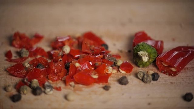 Different red hot pepper spices freshly ground on wooden background. Top view, jalapeno mexican