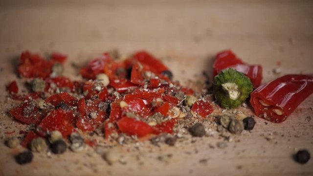 Different red hot pepper spices freshly ground on wooden background. Top view, jalapeno mexican