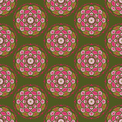 Vector seamless background pattern of circular ornament colored mandala repeating on green background