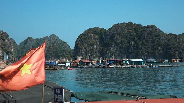  Boats at the pier of Halong Bay. HaLong Bay is a UNESCO World Heritage Site and popular travel destination. Full HD stock footage. 
