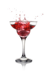 Splash in glass of a pink alcoholic cocktail drink