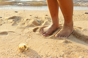 Girl standing on the beach