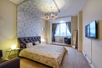 Russia, Moscow - modern designer renovation in a luxury building. Stylish bedroom interior with double bed