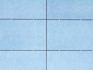 Texture of blue tile on a facade of modern building 