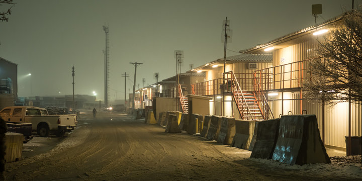 Barracks on military installation in Afghanistan during snow in winter at Night