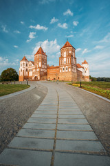 Mir, Belarus. Mir Castle Complex On Blue Sunny Sunset Sky Backgr