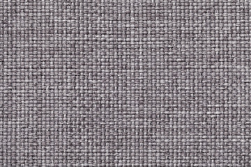 Fototapeta na wymiar Gray background with braided checkered pattern, closeup. Texture of the weaving fabric, macro.
