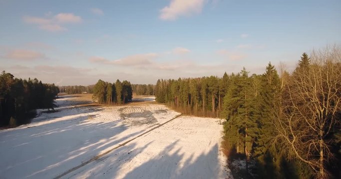 First sunny spring days. Aerial drone footage. Camera moves over trees and river