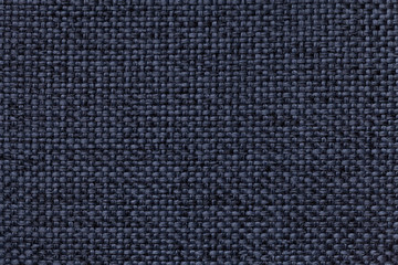 Blue background with braided checkered pattern, closeup. Texture of the weaving fabric, macro.