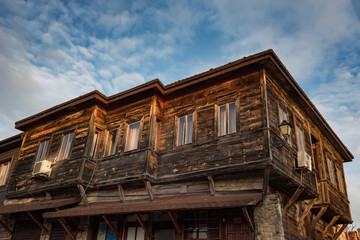 Fototapeta na wymiar Old Bulgarian houses in the town of Nesebar, Bulgaria. In 1956 Nesebar was declared as museum city, archaeological and architectural reservation by UNESCO.