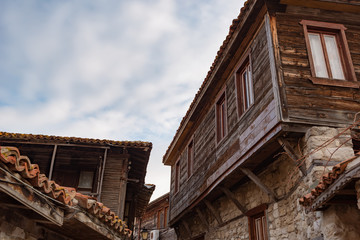 Fototapeta na wymiar Old Bulgarian houses in the town of Nesebar, Bulgaria. In 1956 Nesebar was declared as museum city, archaeological and architectural reservation by UNESCO.