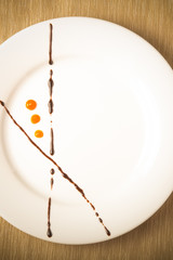 Plate painted strokes of different sauces. Toned