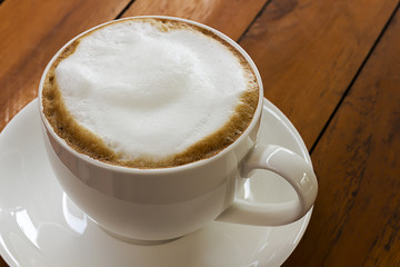 Hot coffee in a white cup