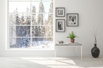 White empty room with winter landscape in window. Scandinavian interior design. 3D illustration © AntonSh