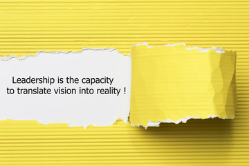 Leadership is the capacity to translate vision into reality written under torn paper