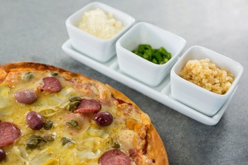 Italian pizza served with various ingredients