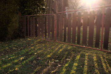 Small Fence with Sunlight in House Yard