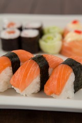 Three nigiri sushi served in white plate