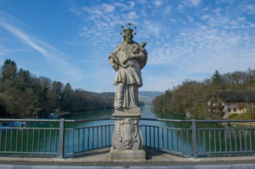 Statue of John of Nepomuk in frint of the Rhine River