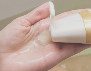 Shampoo in female hand.