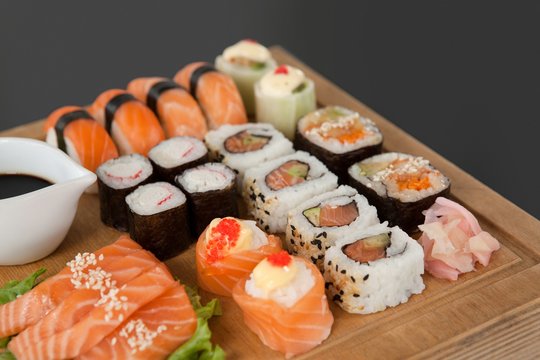 Assorted sushi set served on wooden tray 