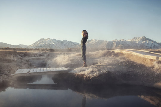 Woman relaxing by hot spring