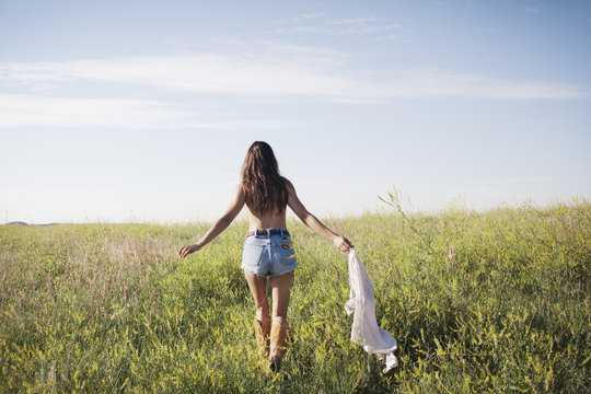 Mid-adult woman walking in field