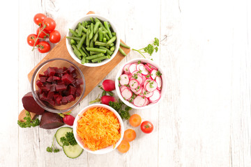 Fototapeta na wymiar assorted vegetable salad and ingredients