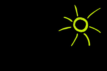 Sonnensymbol auf schwarzer Tafel