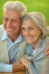 Happy elderly couple embracing