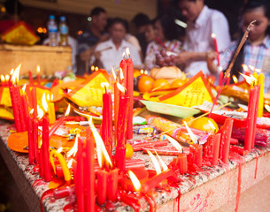 Offerings to gods in  temple with flowers, food and aroma sticks