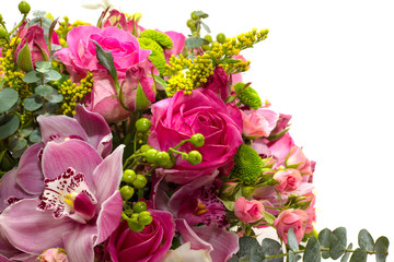 Flower arrangement of roses and orchids on a white background.