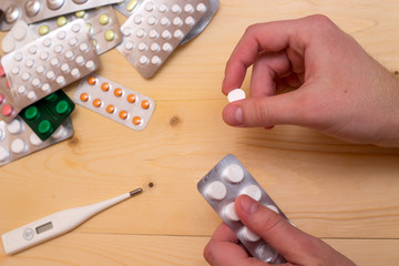 Medical tablets, antibiotics, capsules and pills on the table
