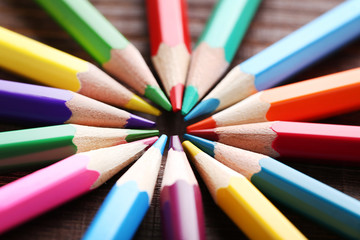 Fototapeta premium Drawing colourful pencils on brown wooden table