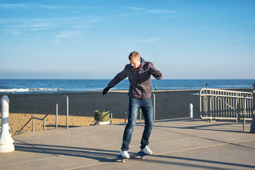 Young man is riding on the ripstik