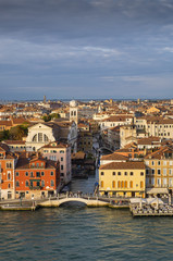 Fototapeta na wymiar Venetian aerial view from the cruise ship which leaves the port of Venice (Venezia Terminal Passegeri Porto). Italy.