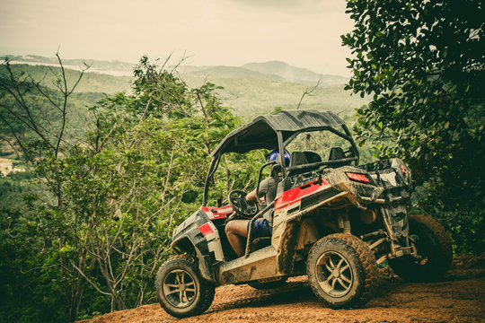 Extreme ride on ATV, buggies, jeeps. Journey through the jungle. Extreme quad biking, dune buggy, Jeep in the jungle, forest / ATV, UTV . in motion.  toned image
