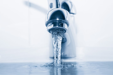Faucet with flowing water closeup