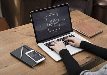 User with Laptop on Desk Mockup 1