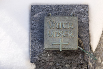 Holy water shell at a grave