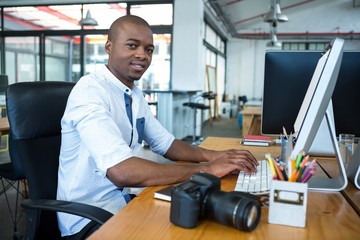 Graphic designer working at desk