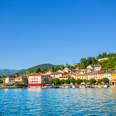 Fototapeta na wymiar View of Motta square on Orta San Giulio from a touristic boat, Lake Orta, Piedmont, Italy