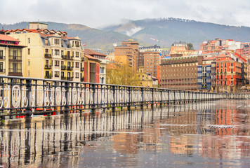 Fototapeta premium colorful old facades of Bilbao city on cloudy day. Spain